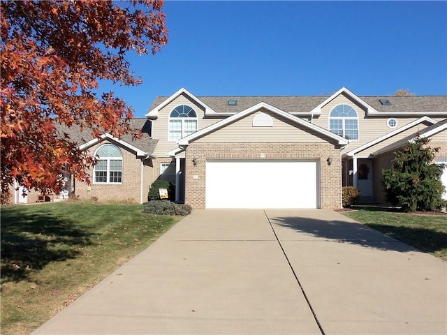 view of front of house with a garage and a front yard