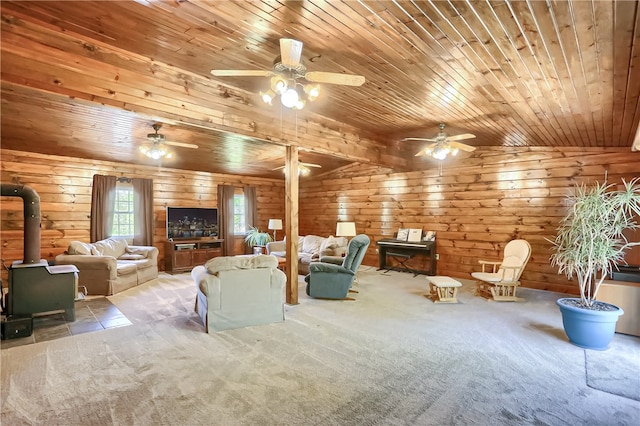 unfurnished living room with a wood stove, wooden ceiling, vaulted ceiling, light colored carpet, and wood walls