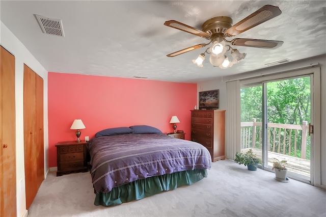 carpeted bedroom featuring ceiling fan and access to outside