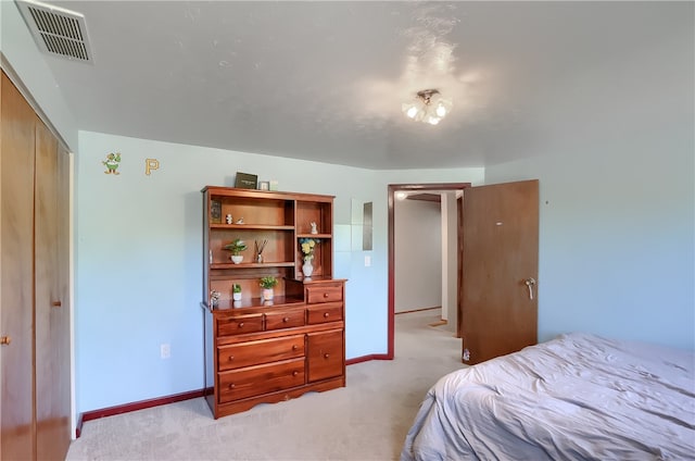 carpeted bedroom featuring a closet