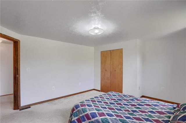 carpeted bedroom with a closet