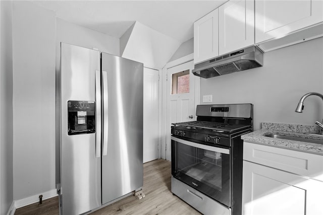 kitchen with exhaust hood, light hardwood / wood-style flooring, stainless steel appliances, sink, and white cabinetry