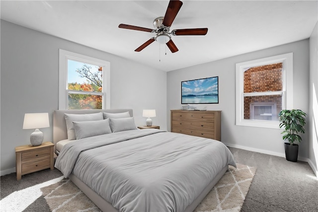 carpeted bedroom featuring ceiling fan