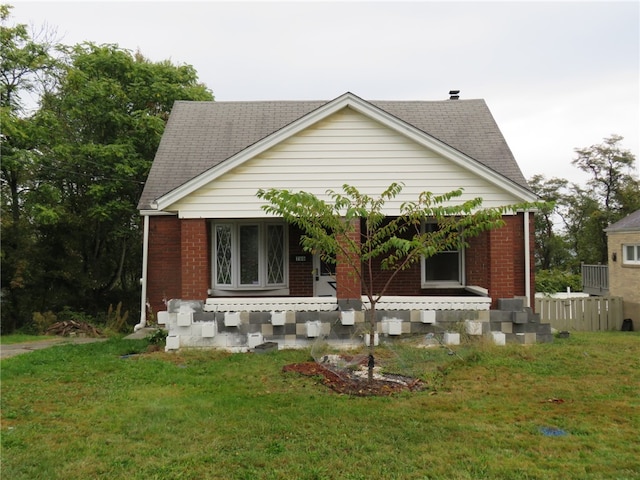 view of front of house featuring a front yard and a porch