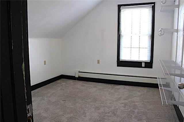 bonus room featuring baseboard heating, vaulted ceiling, and carpet flooring