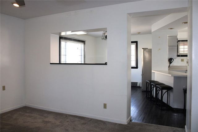 unfurnished room featuring dark hardwood / wood-style floors