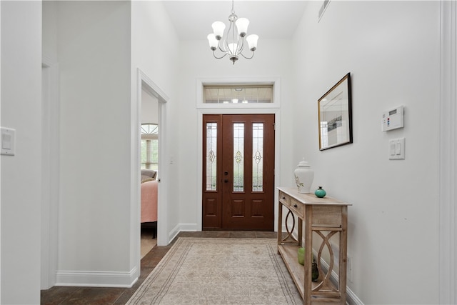 entrance foyer with a chandelier