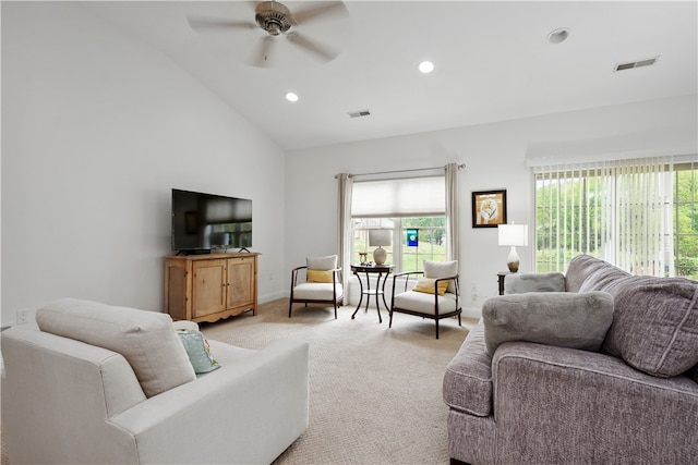 living room with light carpet, high vaulted ceiling, and ceiling fan