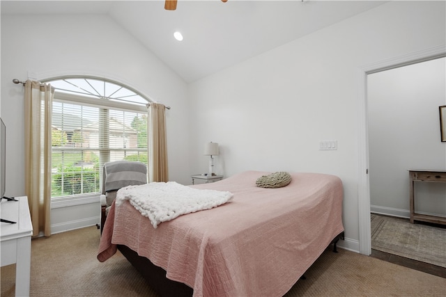 carpeted bedroom with vaulted ceiling and ceiling fan