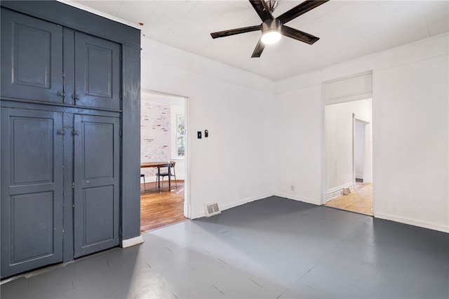 spare room with tile patterned floors and ceiling fan