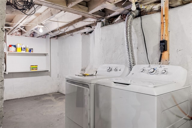 clothes washing area featuring separate washer and dryer