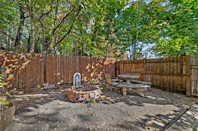 view of yard with a patio area and a fire pit