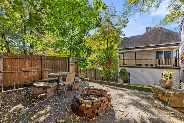 view of patio / terrace featuring an outdoor fire pit