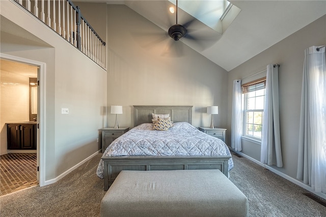 carpeted bedroom featuring high vaulted ceiling and ceiling fan