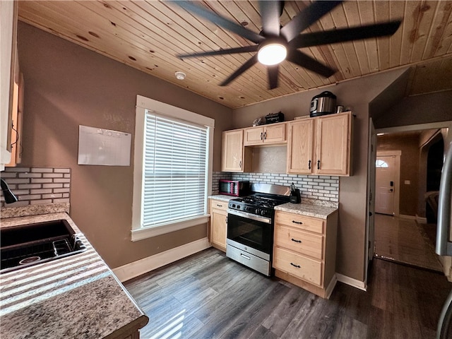 kitchen featuring gas stove, wood ceiling, tasteful backsplash, dark hardwood / wood-style floors, and sink