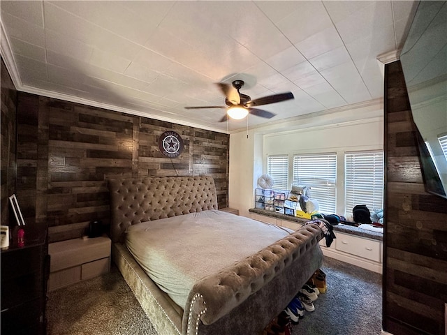 carpeted bedroom with ornamental molding, wooden walls, and ceiling fan