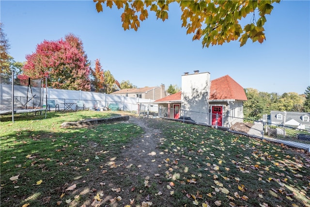 view of yard with a trampoline