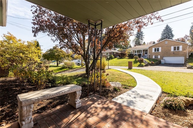 view of home's community with a yard