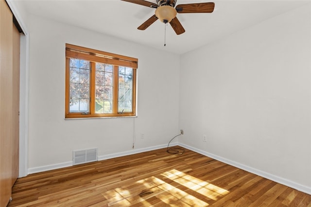 spare room with light hardwood / wood-style floors and ceiling fan