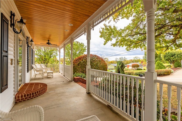 view of patio with ceiling fan and a porch