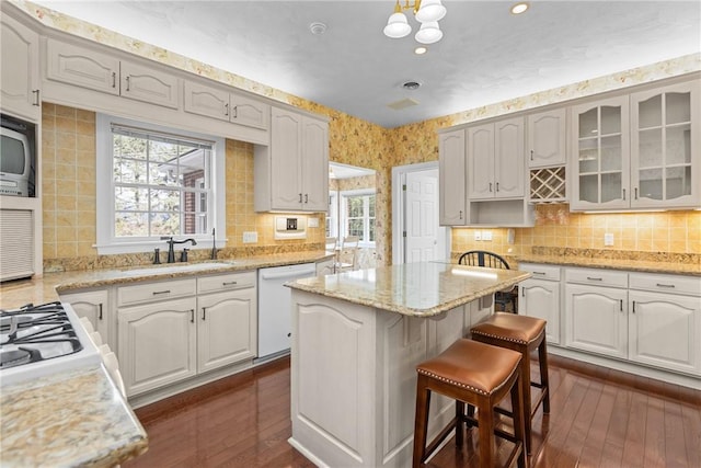 69 Orchard St, Carroll Twp, PA 15022 - kitchen featuring dishwasher, a sink, stainless steel microwave, healthy amount of natural light, and recessed lighting