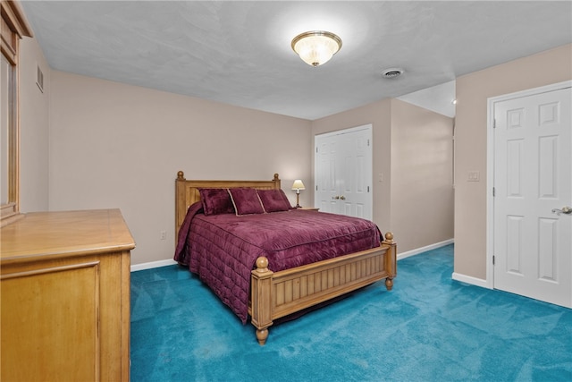 bedroom featuring a closet and carpet floors