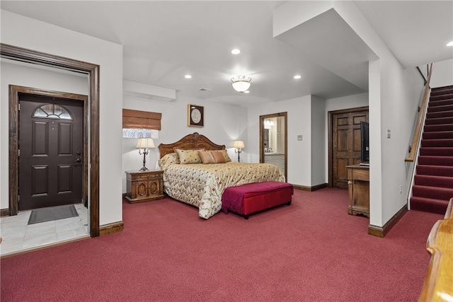 bedroom with carpet flooring and ensuite bath