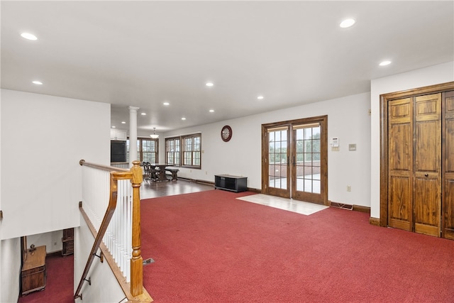 workout area with french doors, carpet floors, and decorative columns