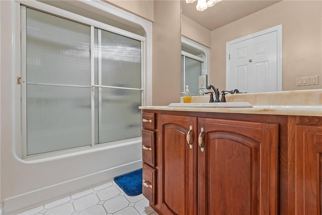 69 Orchard St, Carroll Twp, PA 15022 - bathroom featuring tile patterned floors, enclosed tub / shower combo, and vanity