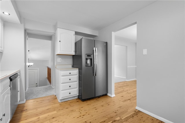 kitchen featuring light hardwood / wood-style flooring, stainless steel appliances, and white cabinetry