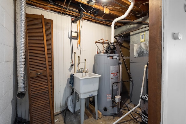 utilities with sink and gas water heater