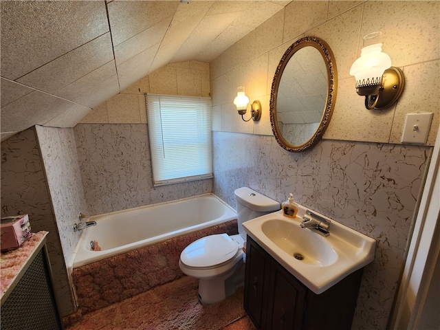 bathroom featuring a relaxing tiled tub, toilet, tile walls, lofted ceiling, and vanity