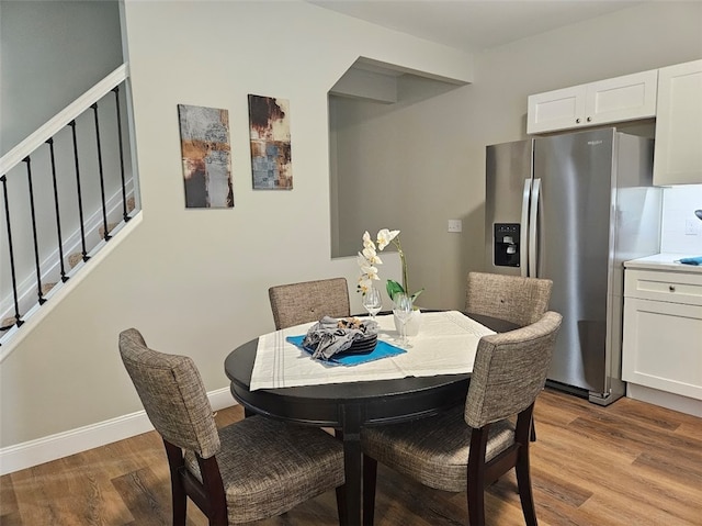 dining area with light wood-type flooring