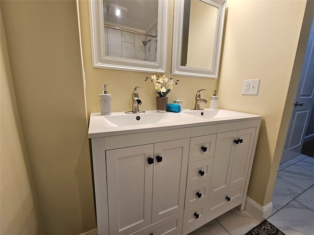 bathroom with vanity, a shower, and tile patterned floors