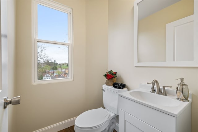 bathroom with toilet and vanity