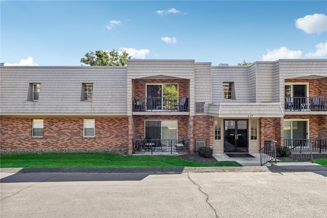 view of front of home with a balcony