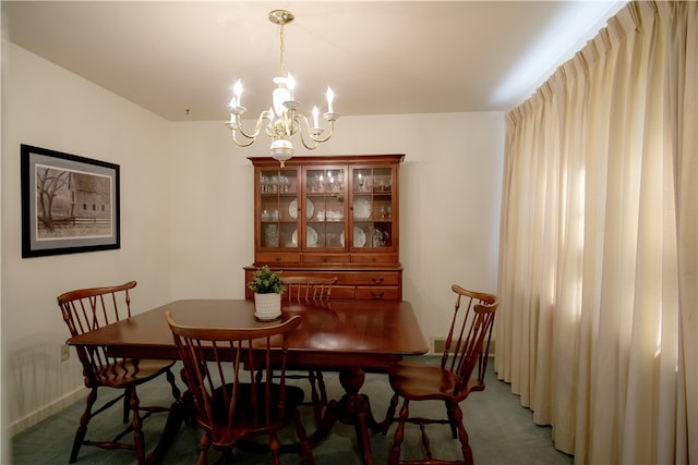 carpeted dining area featuring a notable chandelier