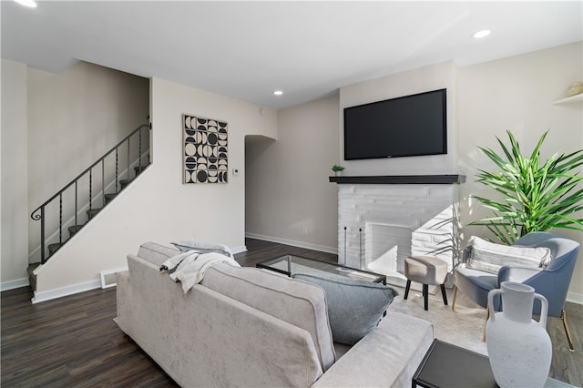 living room featuring dark wood-type flooring