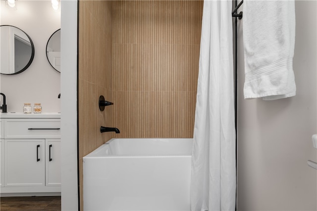 bathroom featuring vanity, hardwood / wood-style flooring, and shower / bath combo