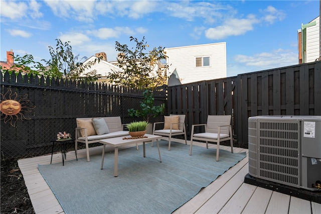 wooden deck featuring central air condition unit and an outdoor hangout area