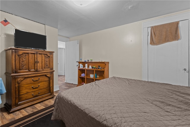 bedroom featuring hardwood / wood-style floors