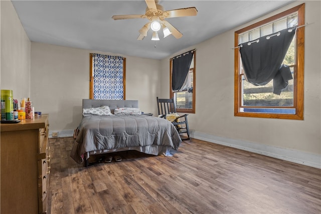 bedroom featuring hardwood / wood-style floors and ceiling fan