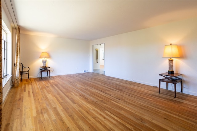 unfurnished room featuring light hardwood / wood-style floors