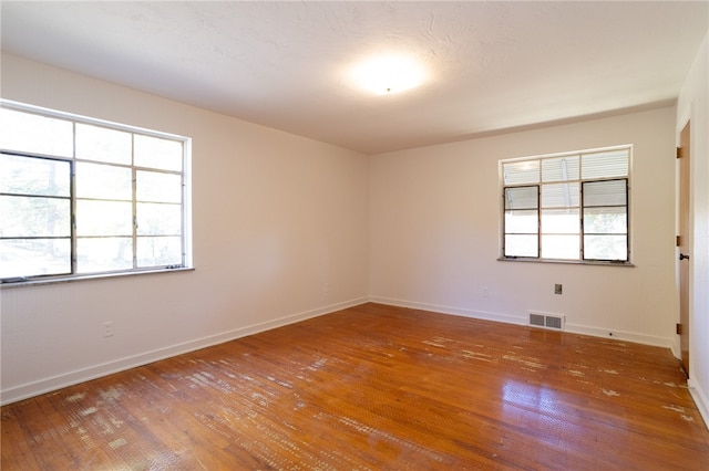 spare room featuring hardwood / wood-style floors