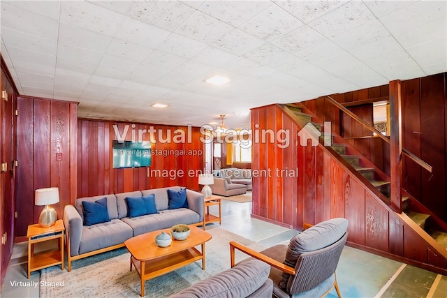 living room featuring wood walls