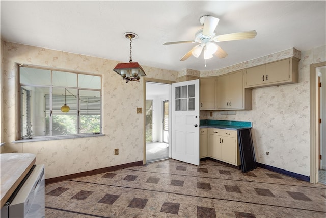 kitchen featuring cream cabinets, decorative light fixtures, and ceiling fan