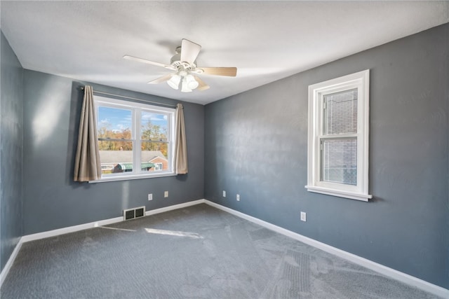 unfurnished room with carpet flooring and ceiling fan