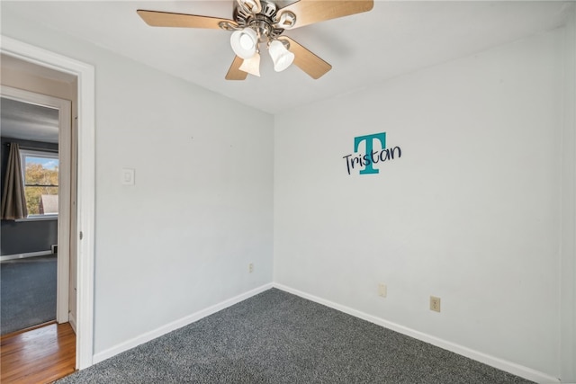 carpeted empty room with ceiling fan