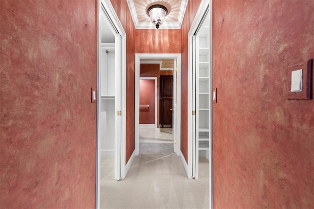 hallway with light carpet and ornamental molding