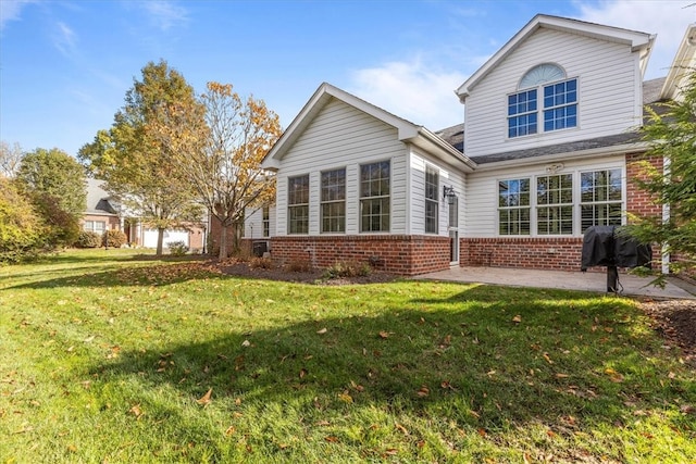 exterior space featuring a patio and a lawn